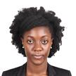 A headshot image of Idy on a white background, she is a black woman wearing a black jacket 